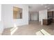 Bright dining area with tile floors and adjacent kitchen at 31550 N Hayweather Ln, San Tan Valley, AZ 85143