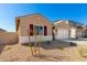 New construction home with a front yard and neutral color scheme at 31550 N Hayweather Ln, San Tan Valley, AZ 85143