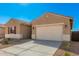 New construction home with a two-car garage and neutral exterior at 31550 N Hayweather Ln, San Tan Valley, AZ 85143