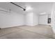 Spacious garage with overhead storage and epoxy floor at 31550 N Hayweather Ln, San Tan Valley, AZ 85143