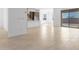 Modern kitchen with island and open concept to living area at 31550 N Hayweather Ln, San Tan Valley, AZ 85143