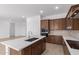 Modern kitchen with stainless steel appliances and island at 31550 N Hayweather Ln, San Tan Valley, AZ 85143