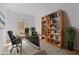 Home office with built-in shelving and a large desk at 31550 N Hayweather Ln, San Tan Valley, AZ 85143