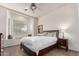 Bright bedroom with a queen-size bed and built-in window seat at 31825 N 141St St, Scottsdale, AZ 85262