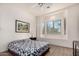 Bedroom featuring a queen bed, bay window, and wood flooring at 31825 N 141St St, Scottsdale, AZ 85262