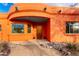 Inviting entryway with wood door and stone accents at 31825 N 141St St, Scottsdale, AZ 85262