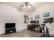 Home office with a desk, exercise bike, and large TV at 31825 N 141St St, Scottsdale, AZ 85262