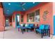 Relaxing covered patio with seating and blue accents at 31825 N 141St St, Scottsdale, AZ 85262