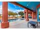 Covered patio with vibrant blue ceiling and pool access at 31825 N 141St St, Scottsdale, AZ 85262