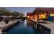 Relaxing pool area with patio furniture and lighting at 31825 N 141St St, Scottsdale, AZ 85262
