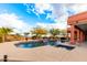 Inviting pool with spa and waterfall feature; expansive patio with seating area at 31825 N 141St St, Scottsdale, AZ 85262