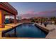 Serene pool with waterfall and stunning sunset views at 31825 N 141St St, Scottsdale, AZ 85262