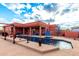 Large rectangular pool; expansive patio and terracotta home at 31825 N 141St St, Scottsdale, AZ 85262