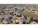 Aerial view of a lakefront community with many homes at 3212 N 109Th Ave, Avondale, AZ 85392