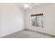 Bright bedroom with ceiling fan and window at 3212 N 109Th Ave, Avondale, AZ 85392