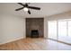 Living room with fireplace and sliding glass doors to patio at 3226 W Julie Dr, Phoenix, AZ 85027