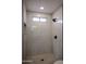 Clean and spacious shower with marble tile at 3226 W Julie Dr, Phoenix, AZ 85027