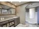 Elegant bathroom with a soaking tub, updated vanity, and tiled flooring at 3315 E Malapai Dr, Phoenix, AZ 85028