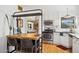 Modern kitchen with white cabinets, butcher block island, and stainless steel appliances at 3317 N 17Th Ave, Phoenix, AZ 85015