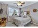 Cozy bedroom with a ceiling fan and ample closet space at 42585 W Heavenly Pl, Maricopa, AZ 85138