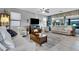 Spacious living room with a fireplace and comfortable seating at 42585 W Heavenly Pl, Maricopa, AZ 85138