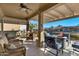 Relaxing patio with fire pit and lake view at 42585 W Heavenly Pl, Maricopa, AZ 85138