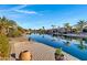 Picturesque waterfront view with canal and palm trees at 42585 W Heavenly Pl, Maricopa, AZ 85138