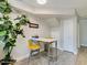 Small dining area with white table and yellow chairs at 510 N Alma School Rd # 237, Mesa, AZ 85201