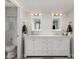 Bathroom with double vanity, marble countertop, and large mirrors at 5266 E Blanche Dr, Scottsdale, AZ 85254