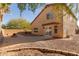 Landscaped backyard with patio and fire pit at 6928 E Four Peaks Way, Florence, AZ 85132