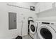 Laundry room with washer, dryer, and storage at 7180 E Kierland Blvd # 308, Scottsdale, AZ 85254