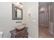 Powder room with vessel sink and decorative mirror at 8437 W Park View Ct, Peoria, AZ 85383