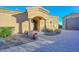 Inviting entryway with a paved courtyard, arched entry, and desert landscaping at 8437 W Park View Ct, Peoria, AZ 85383