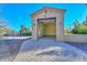 Spacious detached garage with open door, light fixtures and AC unit at 8437 W Park View Ct, Peoria, AZ 85383