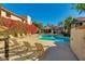 Inviting community pool with lounge chairs and lush landscaping at 9115 E Purdue Ave # 111, Scottsdale, AZ 85258