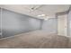 Simple bedroom with ceiling fan and neutral decor at 9459 N 111Th Ave, Sun City, AZ 85351