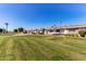 View of a row of homes showcasing a neat and spacious yard at 9459 N 111Th Ave, Sun City, AZ 85351