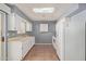 White kitchen cabinets, tile floors, and skylight at 9459 N 111Th Ave, Sun City, AZ 85351