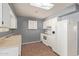 Kitchen with white cabinets and a skylight at 9459 N 111Th Ave, Sun City, AZ 85351