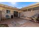 Private patio with brick wall, fountain, and covered seating area at 9459 N 111Th Ave, Sun City, AZ 85351