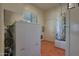 Laundry room with washer, dryer, and water heater at 11430 N 54Th St, Scottsdale, AZ 85254