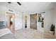 Bedroom with tile floor, large closet with barn door, and access to a bathroom at 1307 N 44Th St, Phoenix, AZ 85008