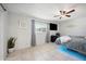 Bright bedroom with tiled floors, ceiling fan, and large window at 1307 N 44Th St, Phoenix, AZ 85008