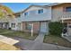 Two-story townhome with gray siding and a small front yard at 1307 N 44Th St, Phoenix, AZ 85008