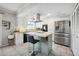 Modern kitchen with white cabinets, stainless steel appliances, and a kitchen island at 1307 N 44Th St, Phoenix, AZ 85008