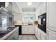 Updated kitchen with white cabinets, wood countertops, and a farmhouse sink at 1307 N 44Th St, Phoenix, AZ 85008