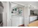 Compact laundry room with side-by-side washer and dryer, and ample storage at 1307 N 44Th St, Phoenix, AZ 85008
