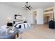 Bright main bedroom featuring modern decor, neutral tones, and a peek into an ensuite bathroom at 13144 E Lupine Ave, Scottsdale, AZ 85259