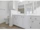 Bathroom with vanity, toilet and large mirror at 14950 W Mountain View Blvd # 6301, Surprise, AZ 85374