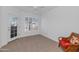 Bright bedroom with patio access and ceiling fan at 14950 W Mountain View Blvd # 6301, Surprise, AZ 85374